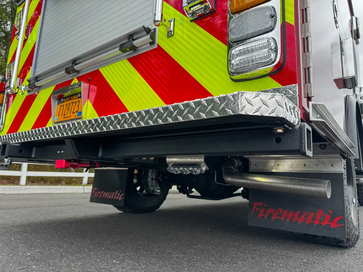 Rear corner compartment open in the chevron panel showing storage cavity.